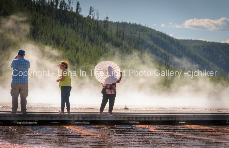 Geyser-Basin-Tourists With Steamy  Background