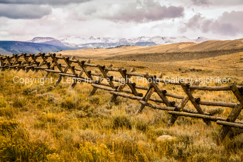Wind-River-Mountains-With-Log-Fence-In-Foreground-Near-Pinedale-Wyoming